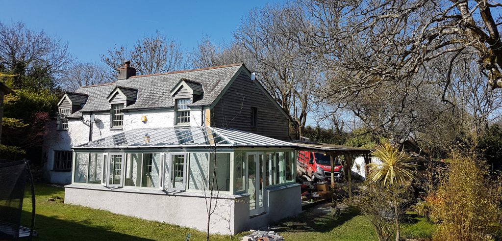 Timber conservatory including energy saving double glazed units