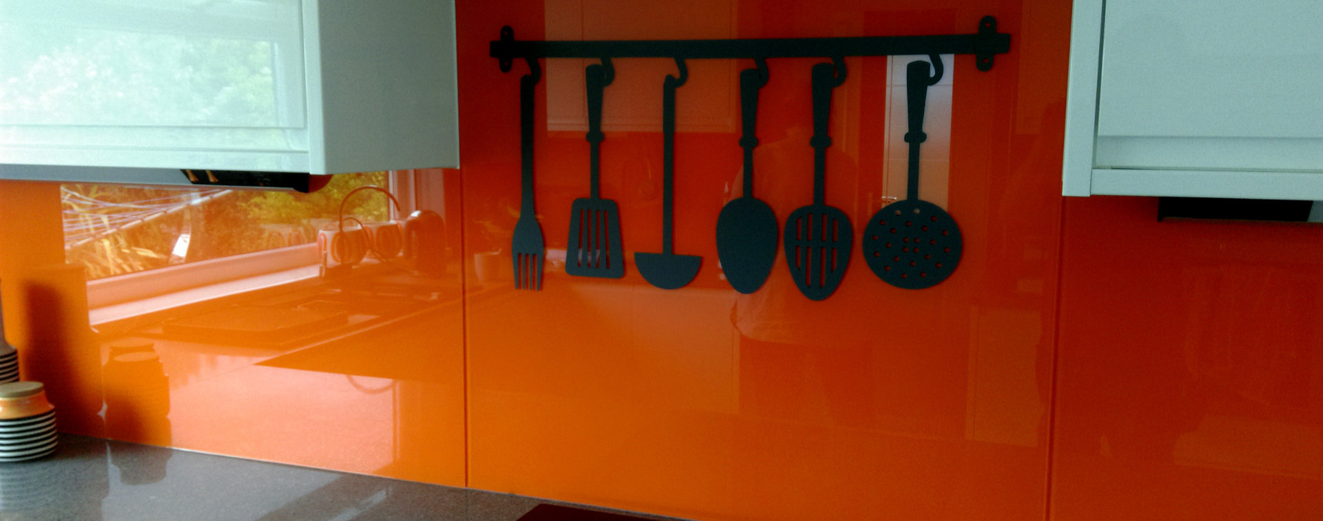 Kitchen orange glass splashback by Gt Glassmasters Cornwall