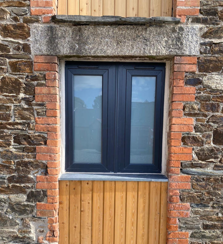 A stunning barn conversion including flush casement uPVC windows achieving a traditional timber window appearance
