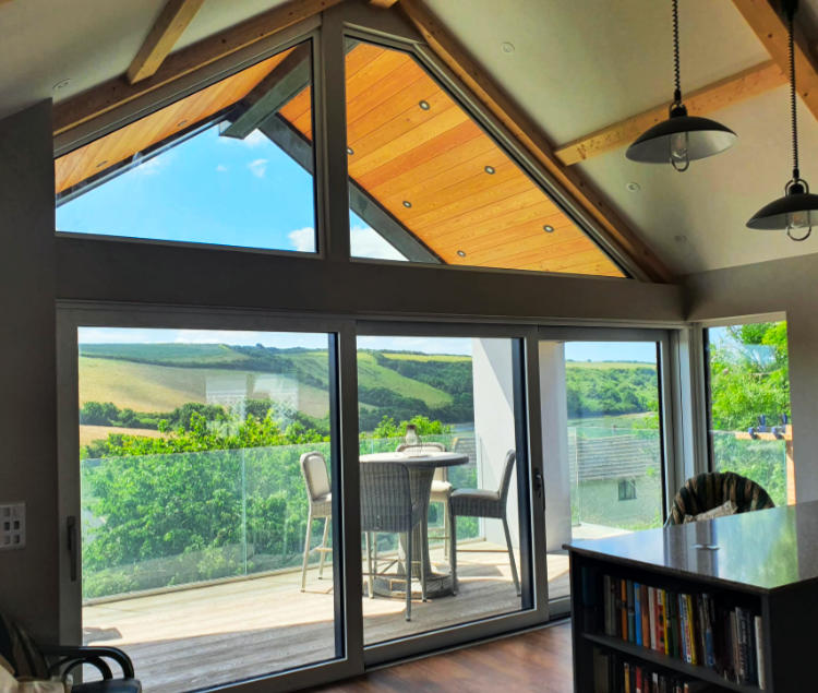 Aluminium shaped windows and lift and slide sliding patio doors supplied and fitted for a job in Newquay