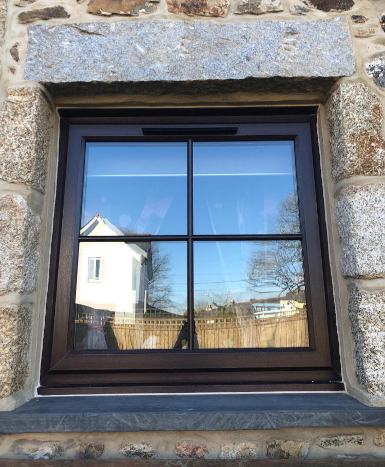 Rosewood uPVC window including astragal bar design